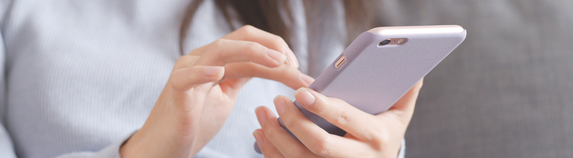 person on phone, closeup of hands